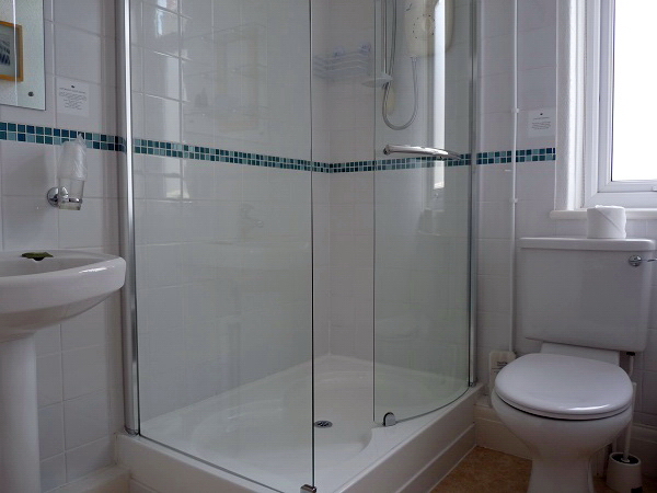 En-suite with shower, basin, WC and heated towel radiator
